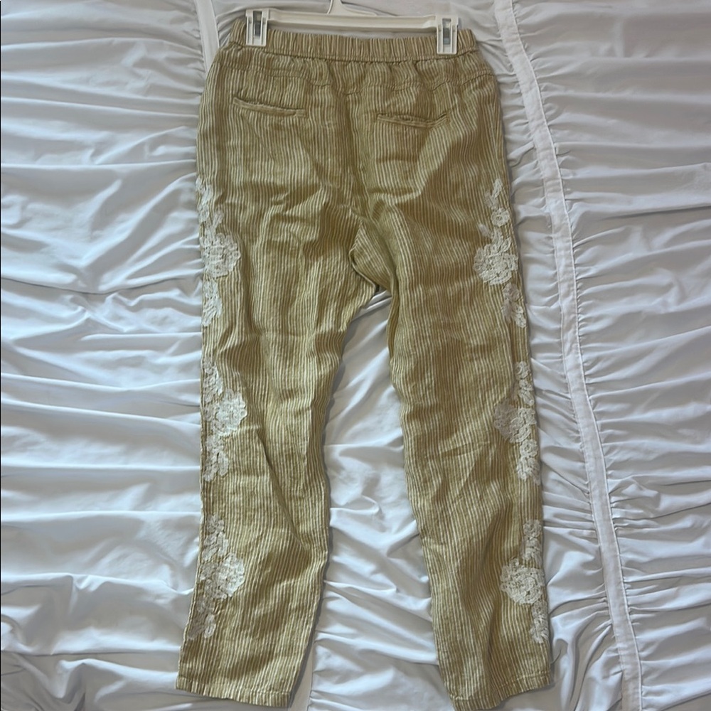 Yellow striped pants with lace embroidery detail